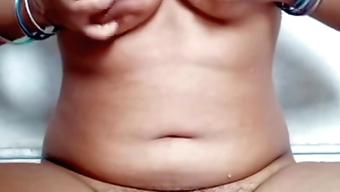 Sexy brunette fingering her hairy pussy in the video