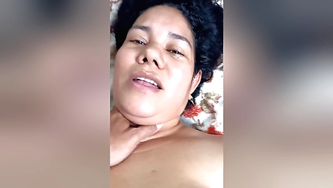 Brunette amateur gamer in red shorts and black tank top