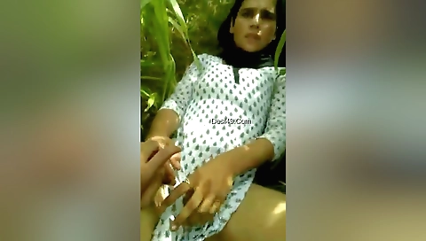 Indian brunette shows off her tight pussy in the sunshine