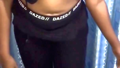 Amateur brunette in a sexy outfit is making a video