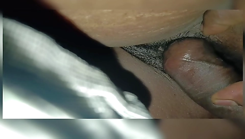 Indian wife sharing with her friend in the kitchen