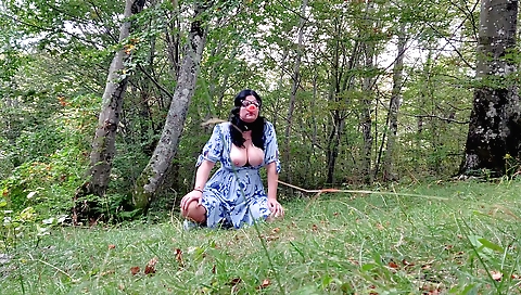 Big boobs amateur girl is playing with the camera outdoors