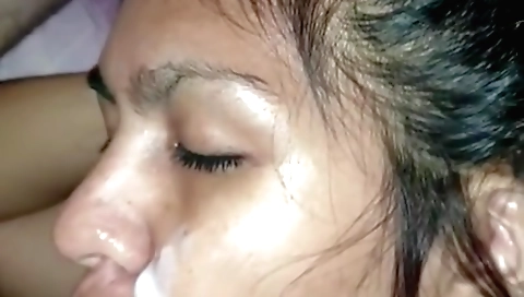 Brunette beauty gets facial on her face in homemade porn