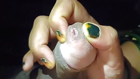 Indian girl is giving a handjob to a dude at a home sex