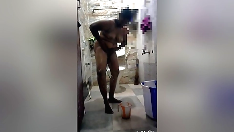 Amateur amateur brunette in a white towel in the bathroom