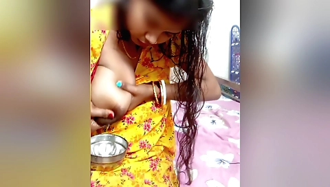 Indian girl with big tits fucks her breasts in the kitchen