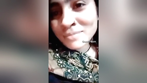 Beautiful brunette with round boobs making a solo clip