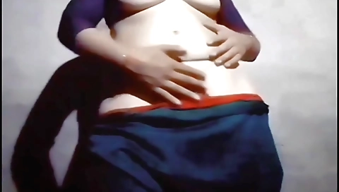 Indian chick with a nice ass fucks herself on the bed