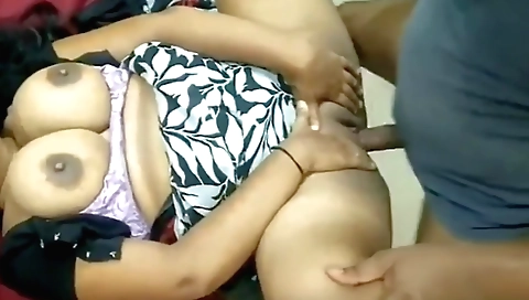 Hot brunette girl is fucking on a webcam on her bed