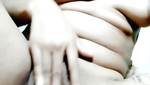 Horny brunette in amateur webcam video is masturbating