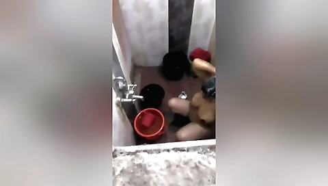 Indian brunette showing off her huge boobs in bathroom