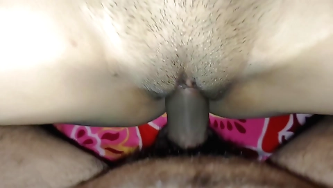 Brunette is filming herself while holding a camera