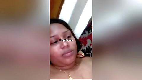 Boudi masturbating with a giant dildo in a bedroom