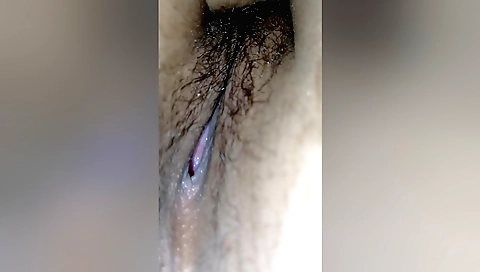 Indian babe plays with her hairy cunt in a lesbian video