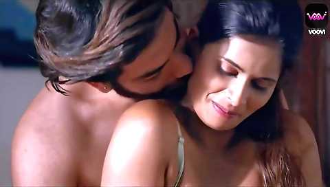 A beautiful brunette with a nice body and a nice figure is standing